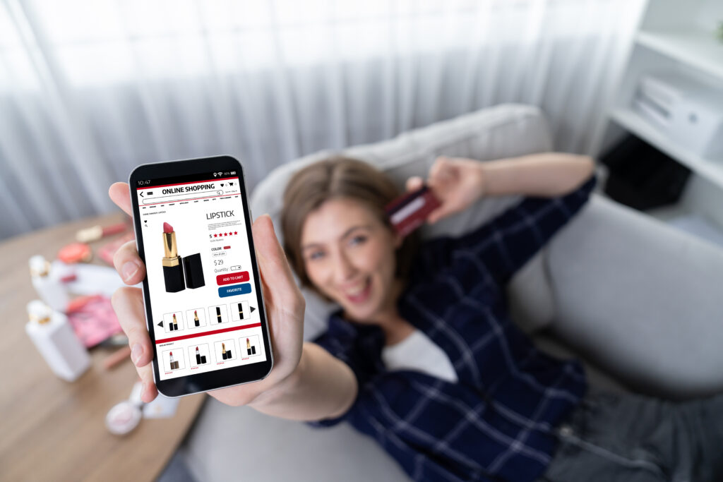How to Sell on TikTok Shop: A Complete Guide 2 Young happy woman buy product by online shopping at home while ordering items from the internet with credit card online payment system protected by utmost cyber security from online store platform