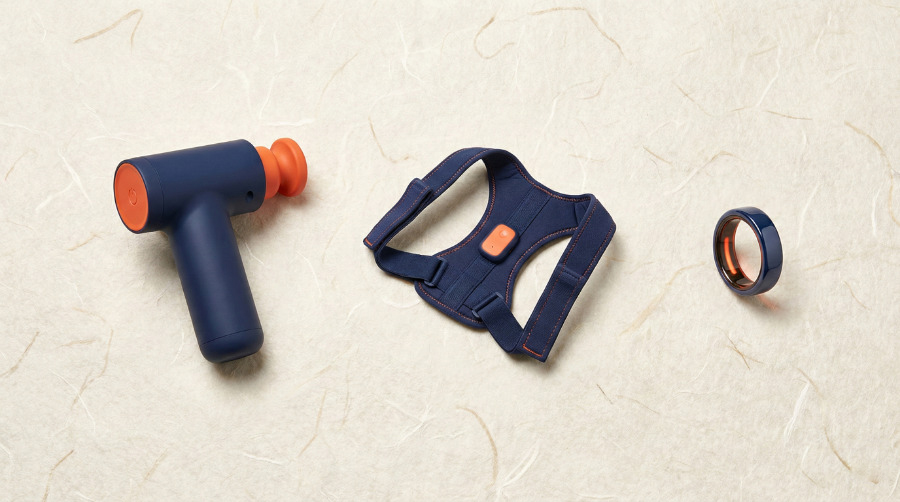 Minimalist wellness tech products including massage gun and posture corrector